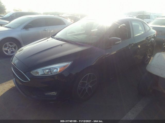 Photo 1 VIN: 1FADP3F26GL203609 - FORD FOCUS 