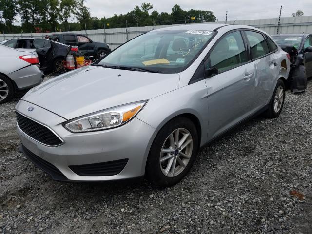 Photo 1 VIN: 1FADP3F26GL389619 - FORD FOCUS SE 