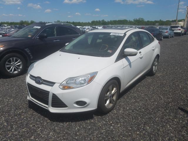 Photo 1 VIN: 1FADP3F27EL304803 - FORD FOCUS SE 