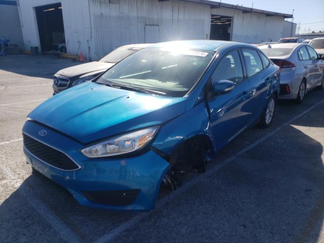 Photo 1 VIN: 1FADP3F27FL288281 - FORD FOCUS SE 