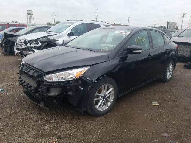 Photo 1 VIN: 1FADP3F27GL211427 - FORD FOCUS SE 