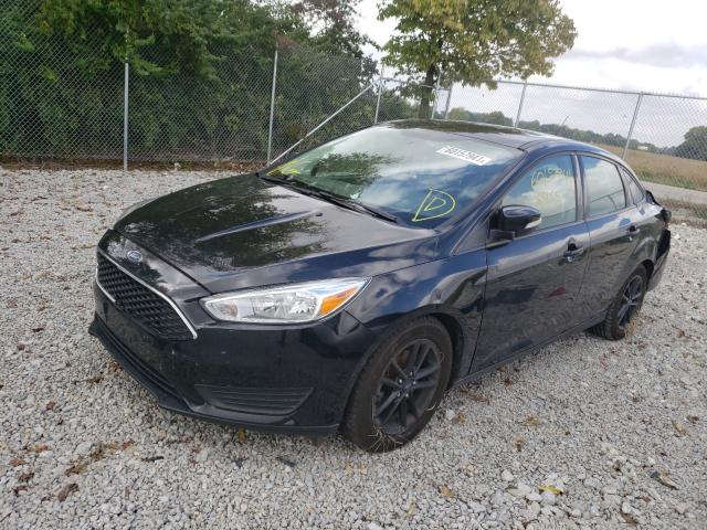 Photo 1 VIN: 1FADP3F27GL301080 - FORD FOCUS SE 