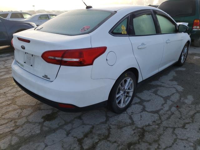 Photo 3 VIN: 1FADP3F27GL399723 - FORD FOCUS SE 