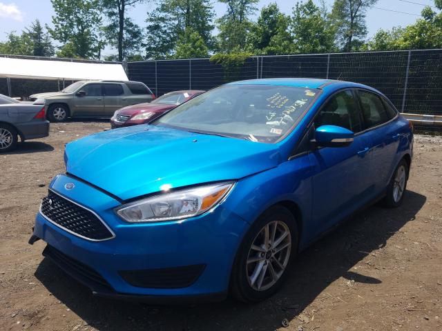 Photo 1 VIN: 1FADP3F27GL402605 - FORD FOCUS SE 