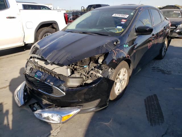 Photo 1 VIN: 1FADP3F27JL208728 - FORD FOCUS 