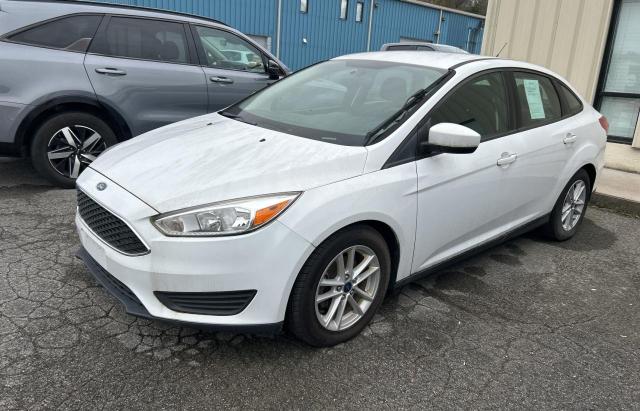 Photo 1 VIN: 1FADP3F27JL218305 - FORD FOCUS SE 