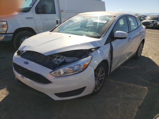 Photo 1 VIN: 1FADP3F27JL279797 - FORD FOCUS 