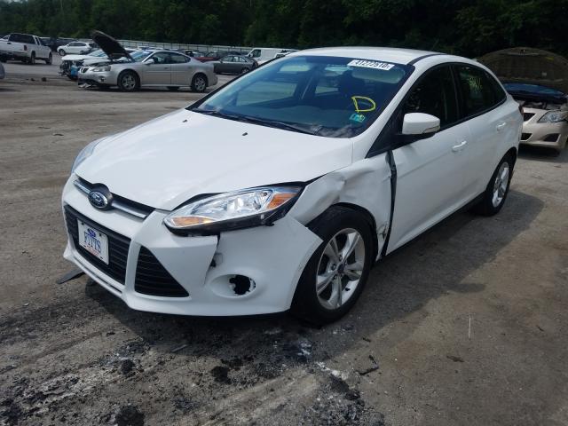 Photo 1 VIN: 1FADP3F28DL122400 - FORD FOCUS SE 