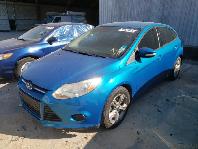 Photo 1 VIN: 1FADP3F28DL359517 - FORD FOCUS SE 