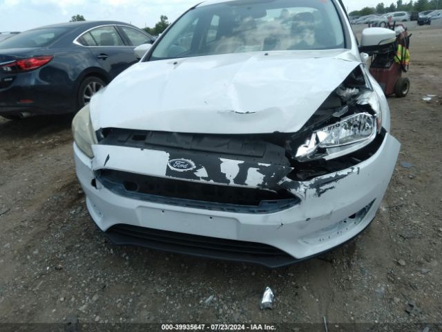 Photo 5 VIN: 1FADP3F28GL208410 - FORD FOCUS 