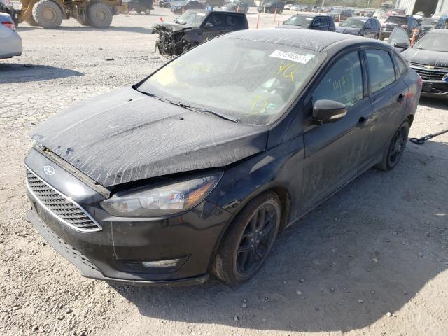 Photo 1 VIN: 1FADP3F28GL214269 - FORD FOCUS SE 