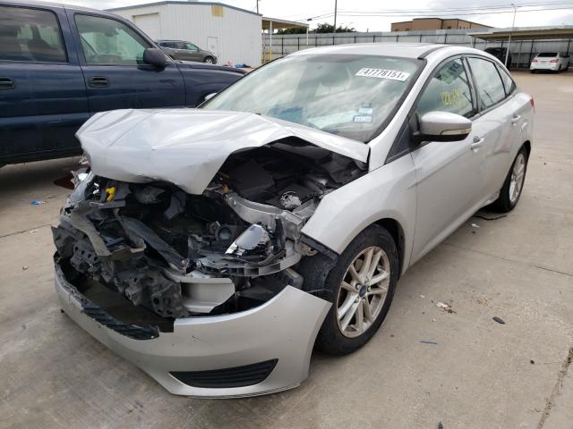 Photo 1 VIN: 1FADP3F28GL217043 - FORD FOCUS SE 