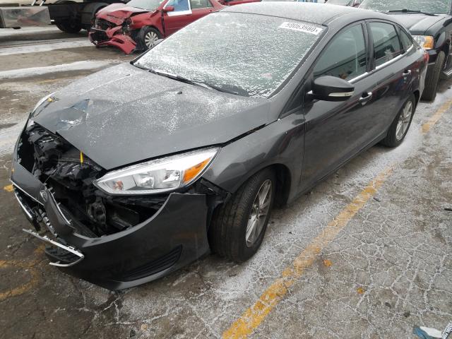 Photo 1 VIN: 1FADP3F28GL220508 - FORD FOCUS SE 