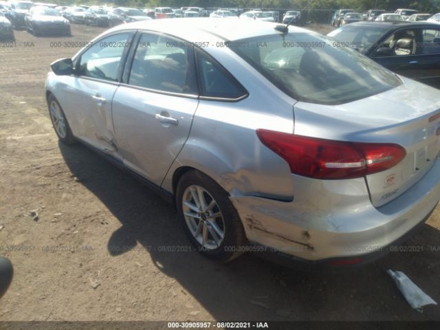 Photo 5 VIN: 1FADP3F28GL243349 - FORD FOCUS 