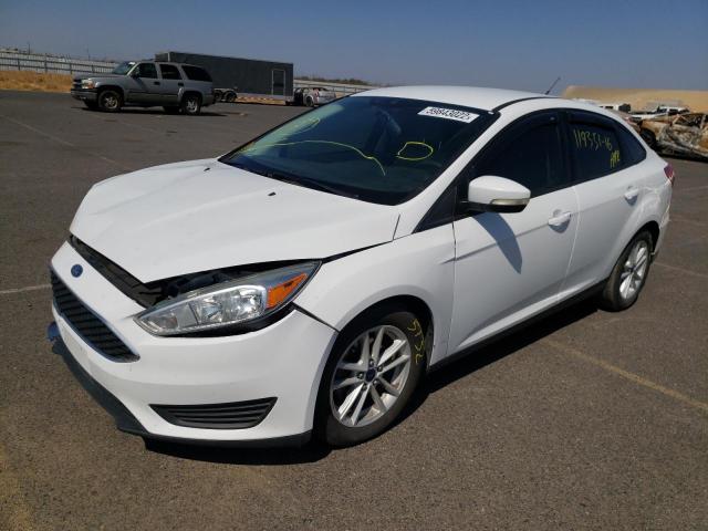 Photo 1 VIN: 1FADP3F28GL271586 - FORD FOCUS SE 