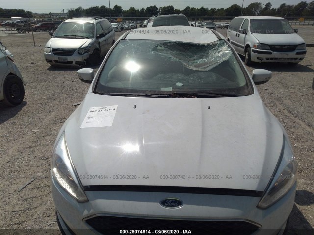 Photo 5 VIN: 1FADP3F28GL291191 - FORD FOCUS 