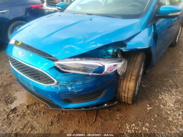 Photo 5 VIN: 1FADP3F28GL324187 - FORD FOCUS 