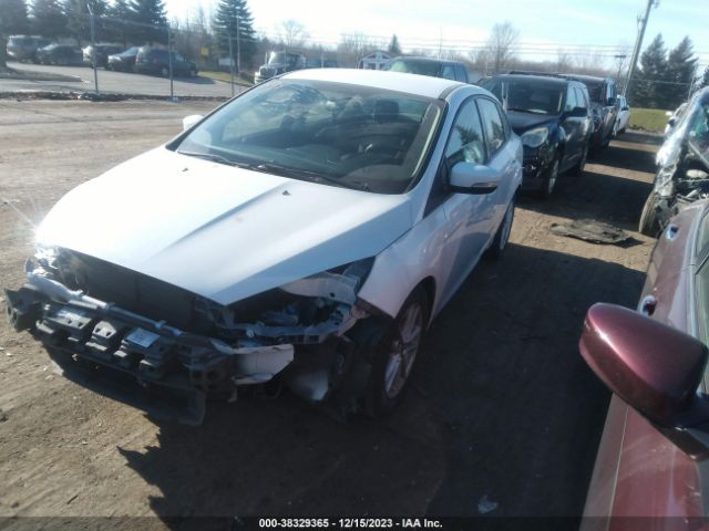 Photo 1 VIN: 1FADP3F28GL340857 - FORD FOCUS 