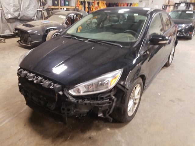 Photo 1 VIN: 1FADP3F28GL390299 - FORD FOCUS SE 