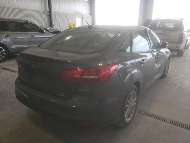 Photo 3 VIN: 1FADP3F28GL396135 - FORD FOCUS SE 