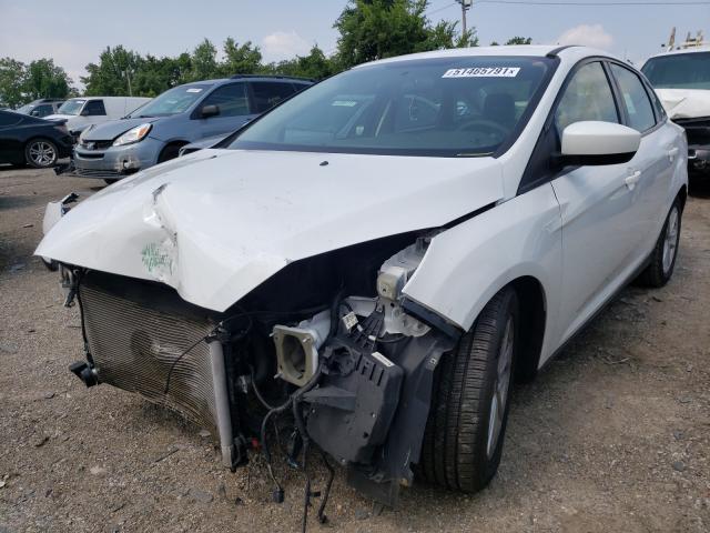 Photo 1 VIN: 1FADP3F28JL207023 - FORD FOCUS SE 