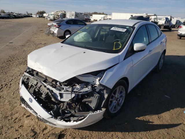 Photo 1 VIN: 1FADP3F28JL260255 - FORD FOCUS SE 