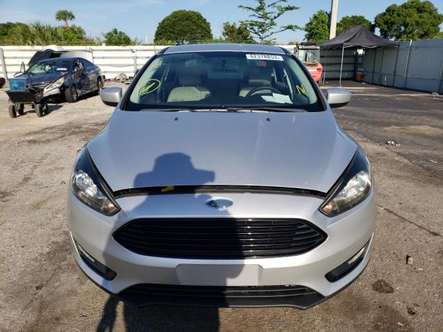 Photo 4 VIN: 1FADP3F28JL299587 - FORD FOCUS SE 