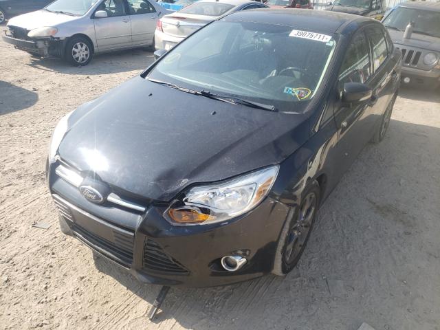 Photo 1 VIN: 1FADP3F29DL274573 - FORD FOCUS SE 