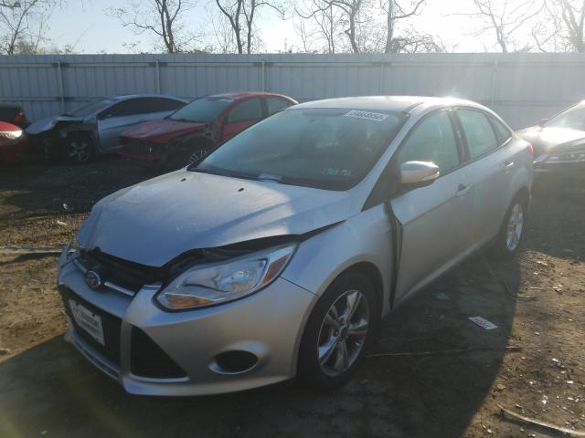 Photo 1 VIN: 1FADP3F29DL369893 - FORD FOCUS SE 