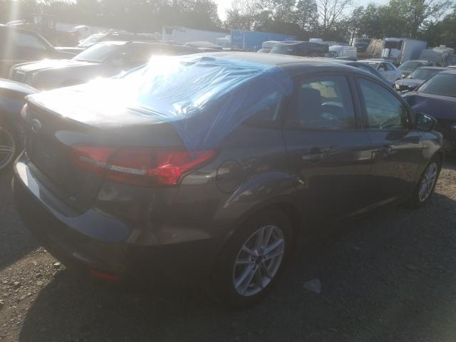 Photo 3 VIN: 1FADP3F29JL307129 - FORD FOCUS 