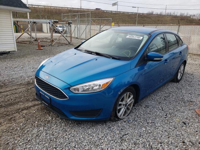 Photo 1 VIN: 1FADP3F2XGL261884 - FORD FOCUS SE 