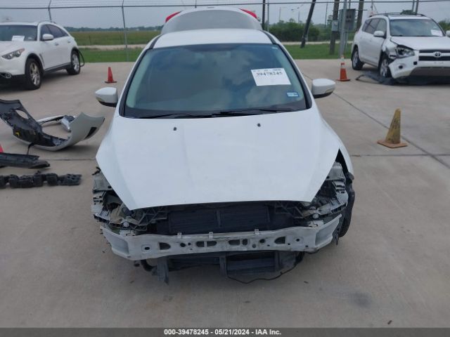 Photo 5 VIN: 1FADP3F2XGL272626 - FORD FOCUS 