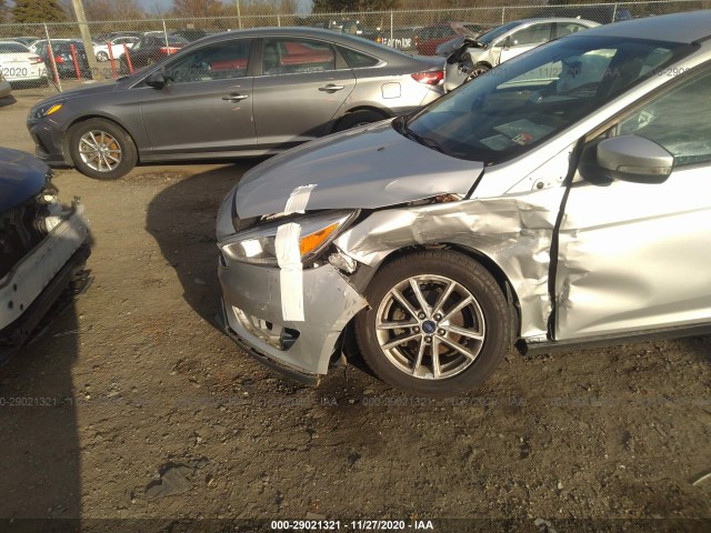 Photo 5 VIN: 1FADP3F2XGL371575 - FORD FOCUS 