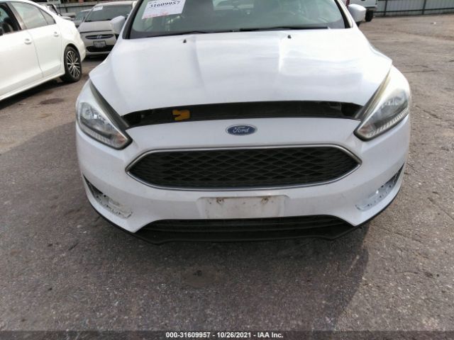 Photo 5 VIN: 1FADP3F2XGL389624 - FORD FOCUS 