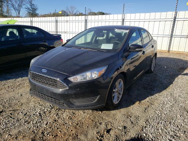 Photo 1 VIN: 1FADP3F2XGL399778 - FORD FOCUS SE 