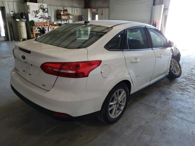 Photo 3 VIN: 1FADP3F2XJL265070 - FORD FOCUS SE 