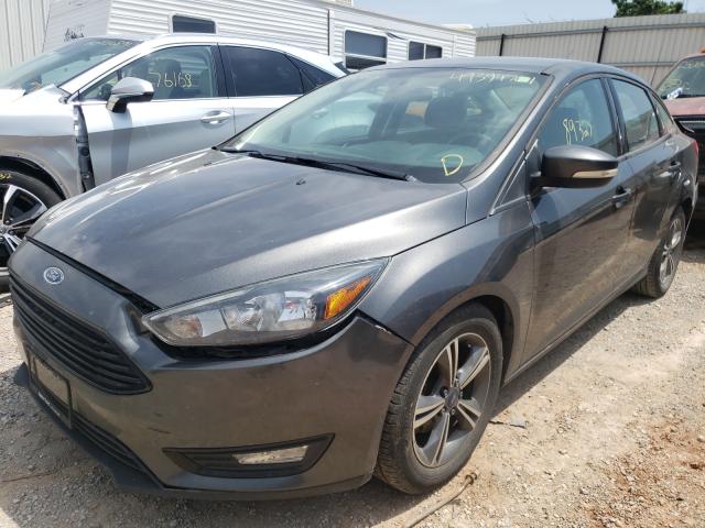 Photo 1 VIN: 1FADP3FE0GL301447 - FORD FOCUS SE 