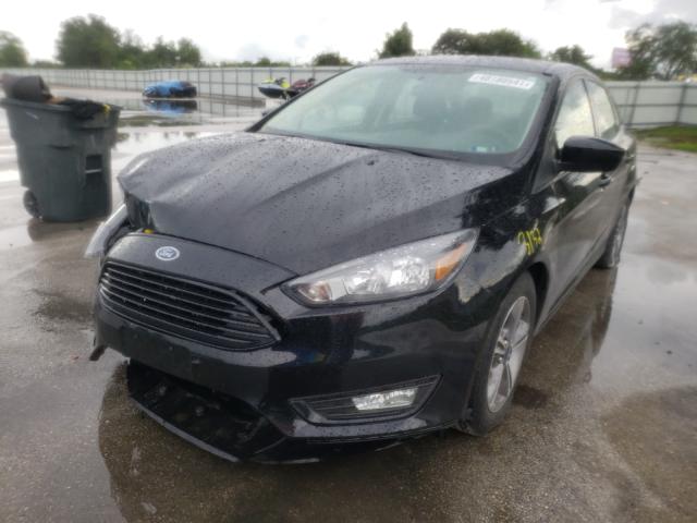 Photo 1 VIN: 1FADP3FE1JL275660 - FORD FOCUS SE 