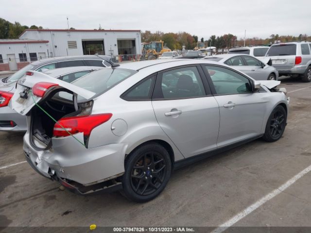 Photo 3 VIN: 1FADP3FE2GL385416 - FORD FOCUS 