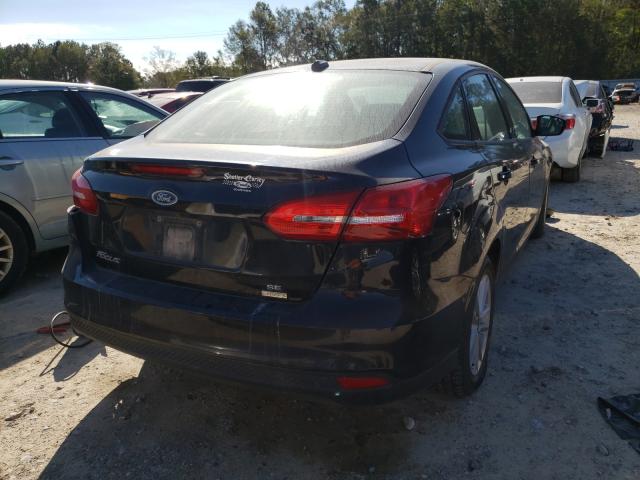 Photo 3 VIN: 1FADP3FE3JL299409 - FORD FOCUS SE 