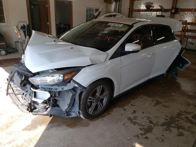 Photo 1 VIN: 1FADP3FE4HL308418 - FORD FOCUS SE 