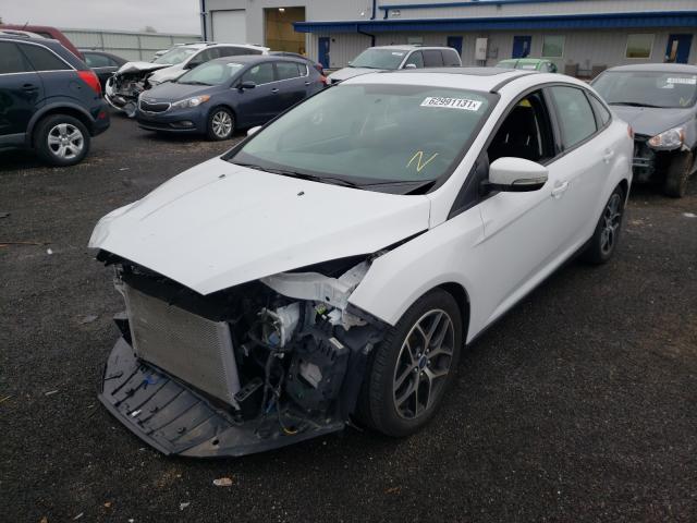 Photo 1 VIN: 1FADP3H26JL228059 - FORD FOCUS SEL 