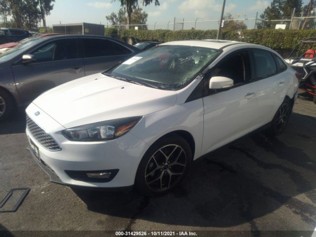 Photo 1 VIN: 1FADP3H2XJL322848 - FORD FOCUS 