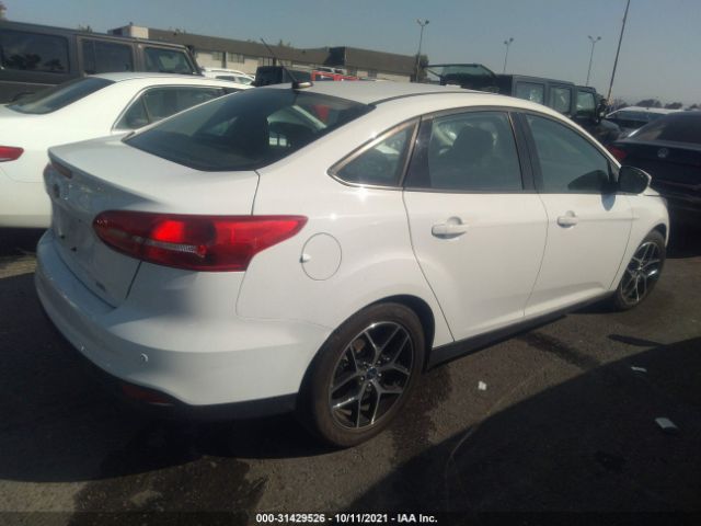 Photo 3 VIN: 1FADP3H2XJL322848 - FORD FOCUS 