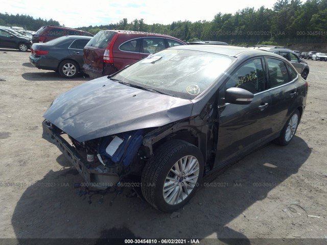 Photo 1 VIN: 1FADP3J2XGL223577 - FORD FOCUS 