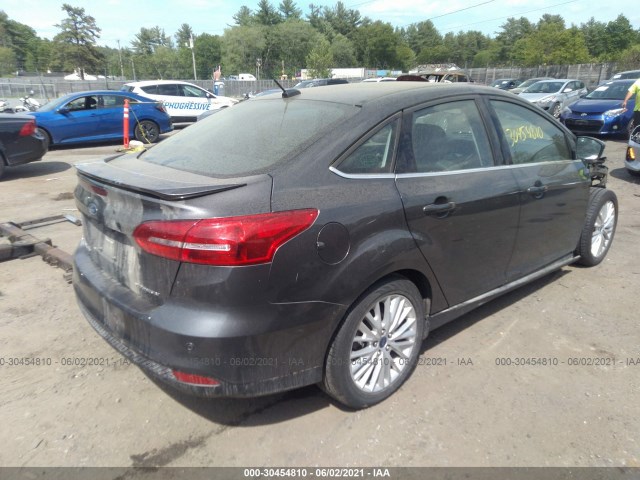 Photo 3 VIN: 1FADP3J2XGL223577 - FORD FOCUS 