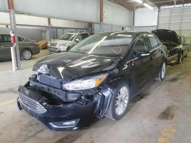 Photo 1 VIN: 1FADP3J2XJL331673 - FORD FOCUS 