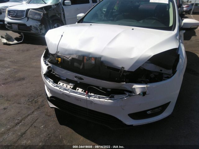 Photo 5 VIN: 1FADP3M24HL314776 - FORD FOCUS 