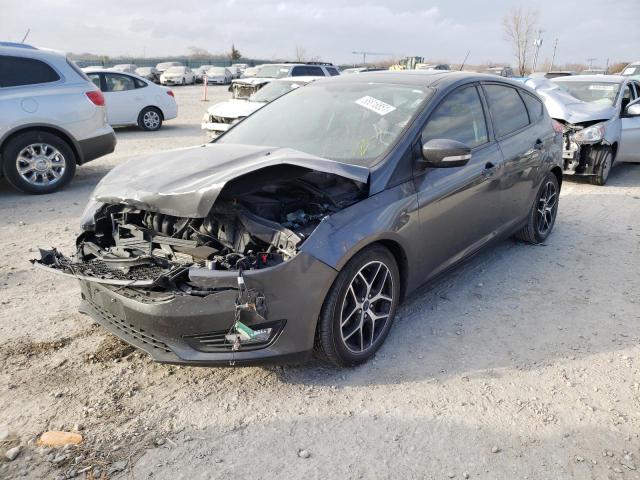 Photo 1 VIN: 1FADP3M2XJL312066 - FORD FOCUS 