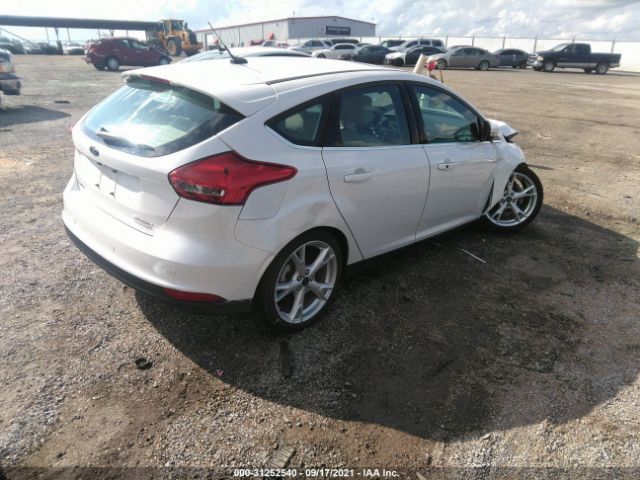 Photo 3 VIN: 1FADP3N21GL406599 - FORD FOCUS 